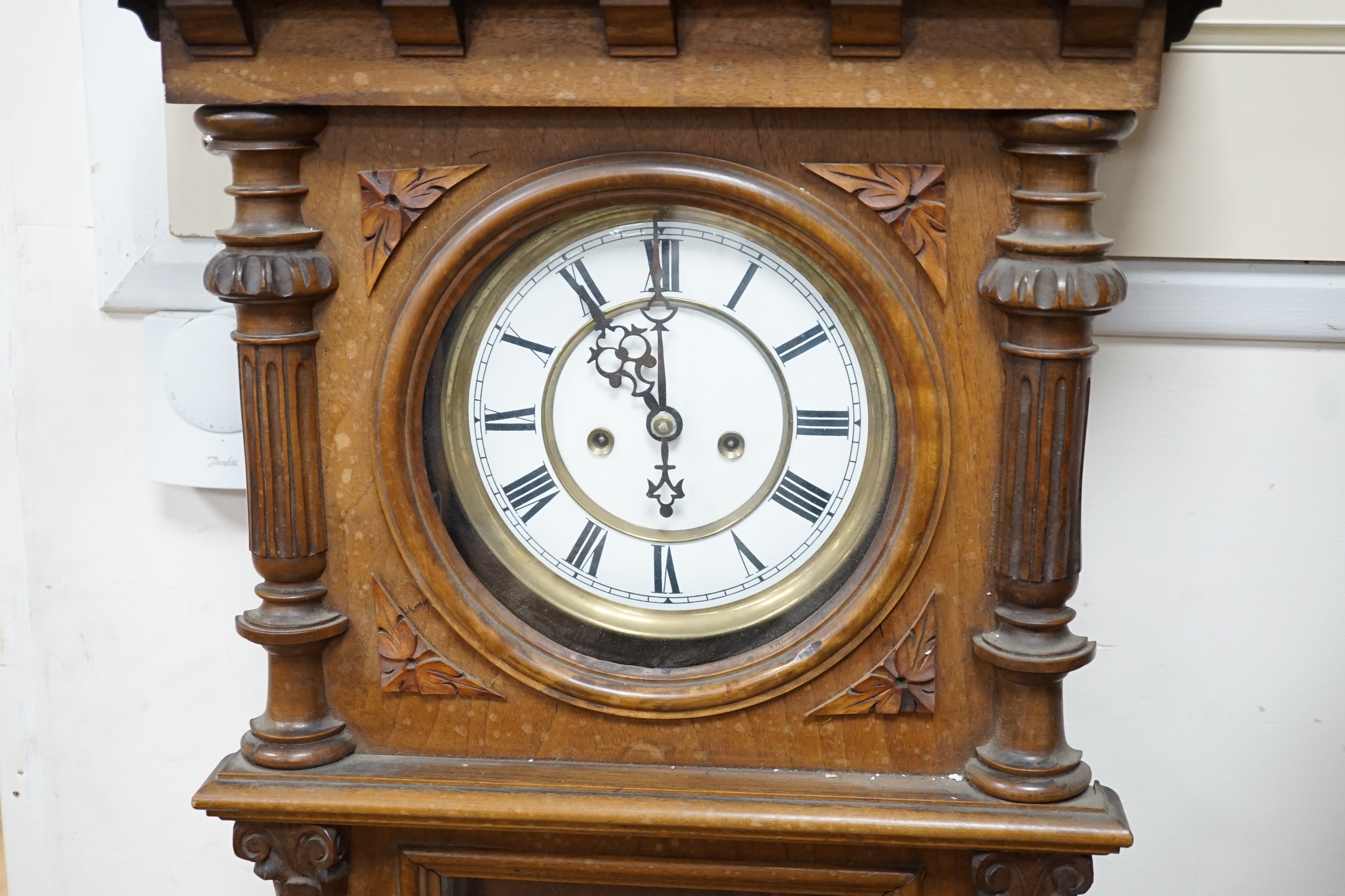 A weight driven Vienna walnut wall clock